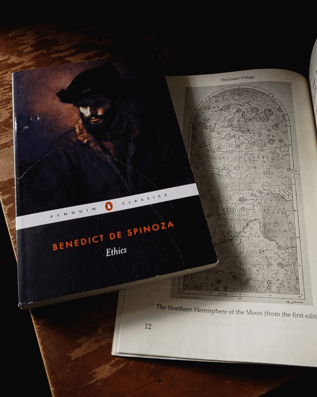 "Photo of Spinoza's ethics and a map of the moon from Jerzy Żuławski's 'On The Silver Globe'"